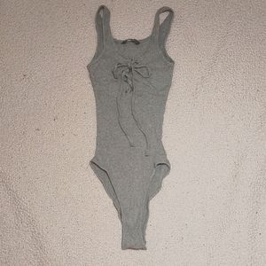 Small grey ribbed body suit